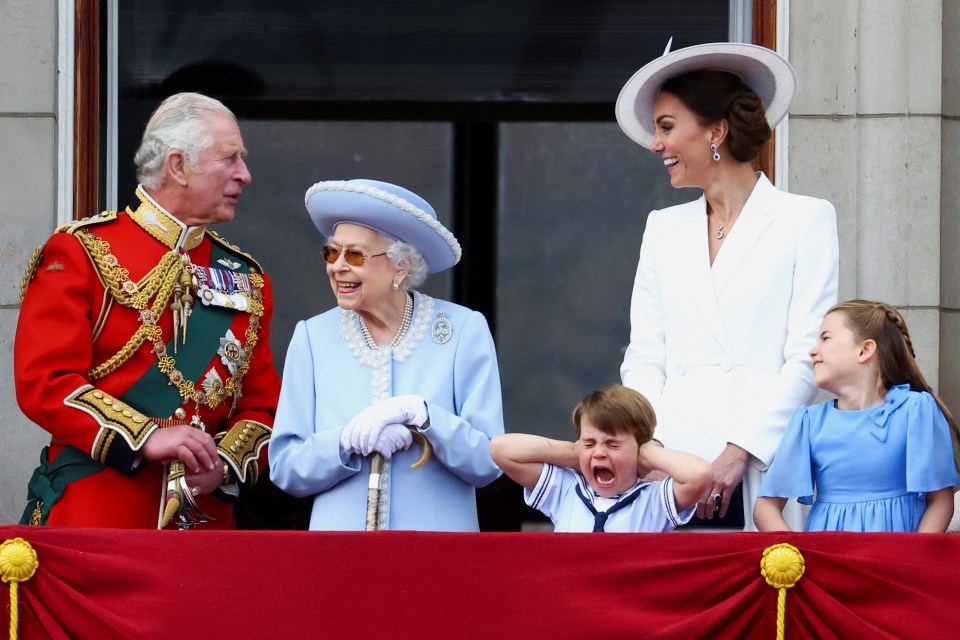 The family beamed as they enjoyed the spectacle - but the noise seemed to be a little too loud for Prince Louis