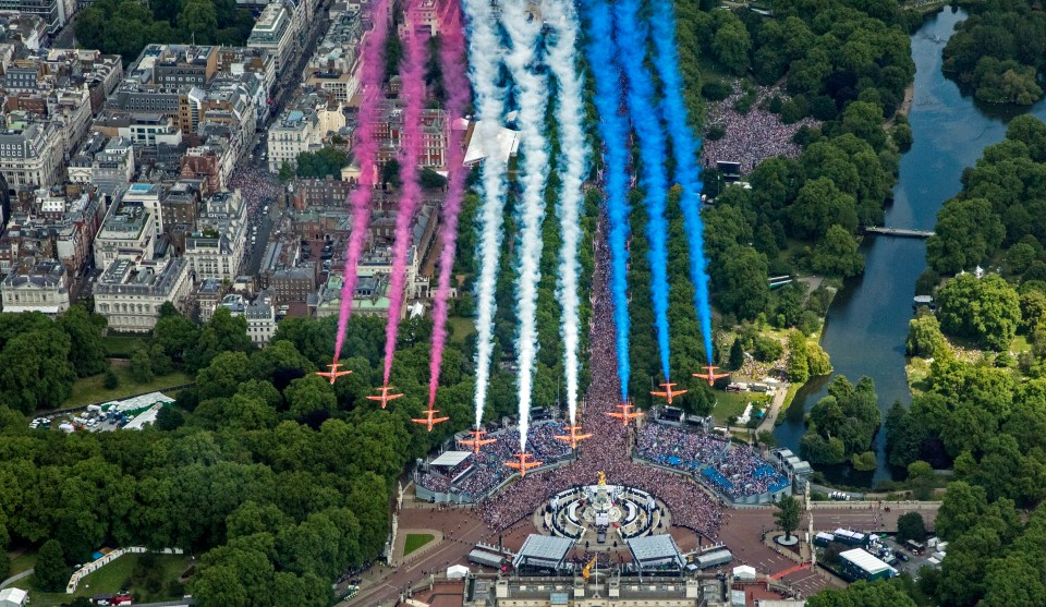 A right royal wingding — defiantly, joyfully British — where Spitfires and Hurricanes flew above the capital, and the Red Arrows plumed with their red, white and blue smoke