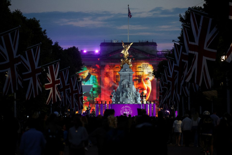 Colourful images of the monarch were projected onto the walls of the palace