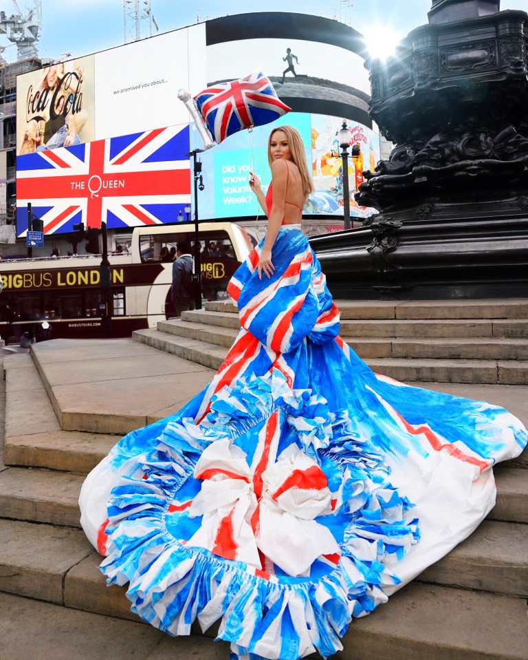 The star waved her flag at the iconic Piccadilly Circus