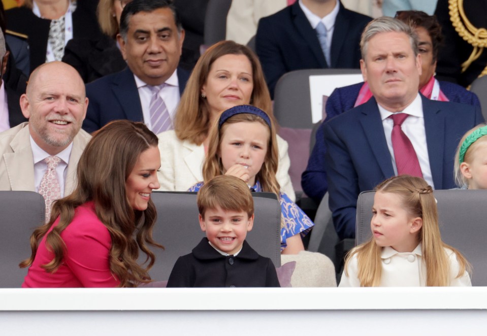 Kate and Keir Starmer watched on at the golden carriage hit the streets