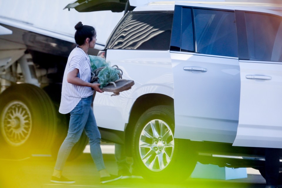 Precious cargo - including what appeared to be a wooden swing - was loaded into a car on Sunday