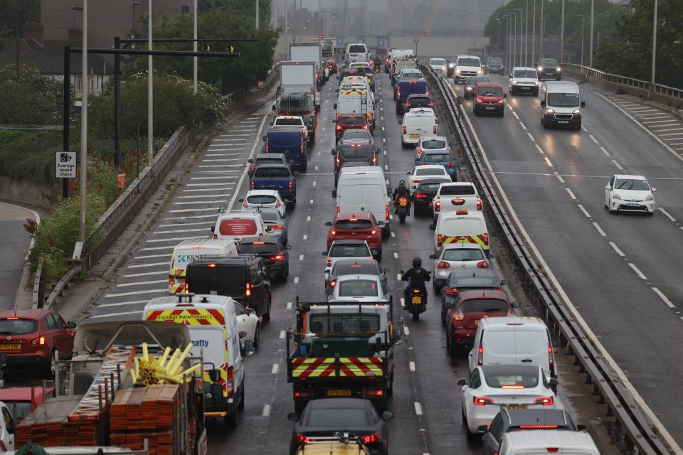 Cars queued on the motorway in the drizzle