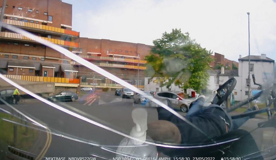 The cyclist cracked the windscreen and bounced off onto the floor