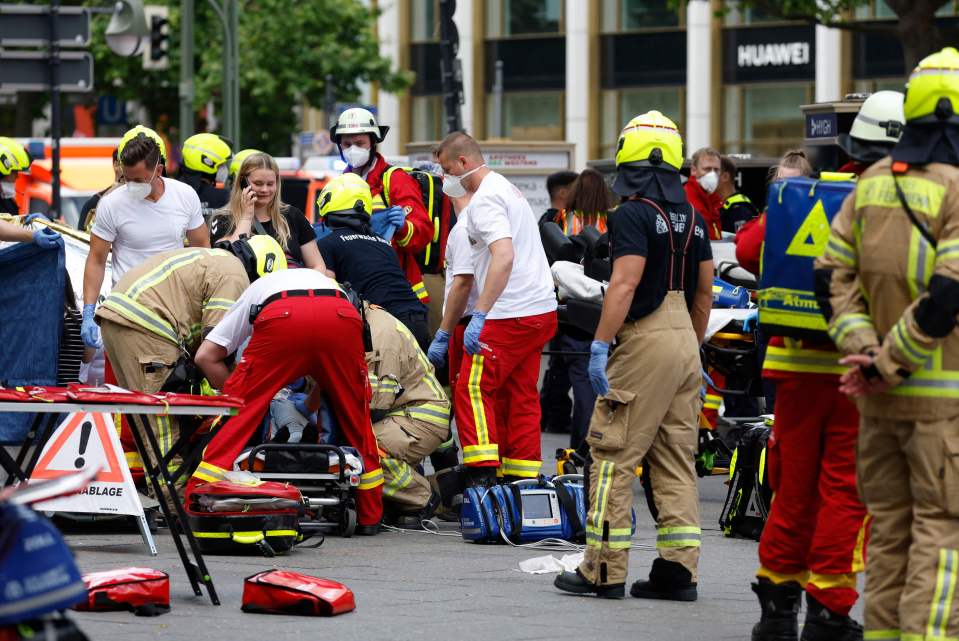 Rescue workers work at the site helping the injured