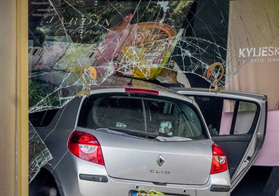 The car ploughed through pedestrians before hitting a shopping centre