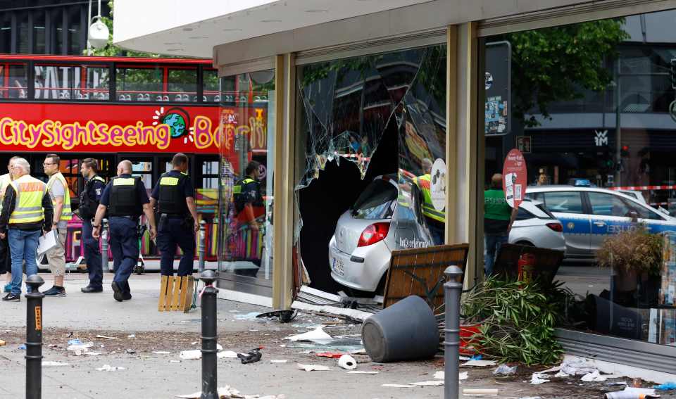 The car zig-zagged through pedestrians before smashing into a shop