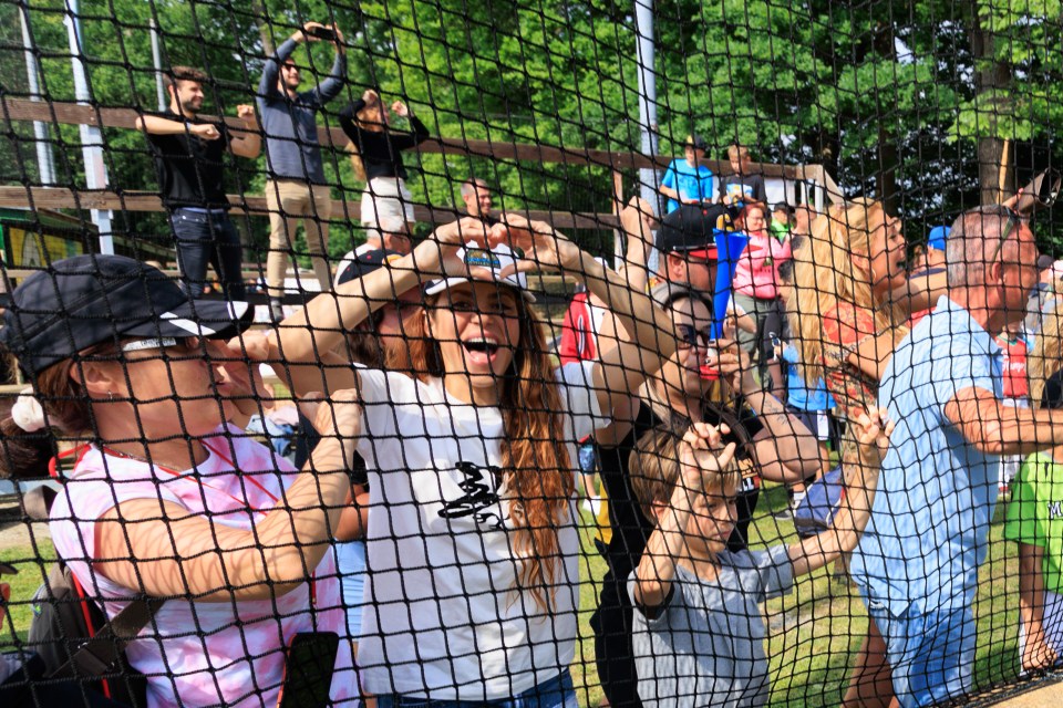 Shakira put on a brave face as she cheered on her son at a baseball tournament, with Pique in the background