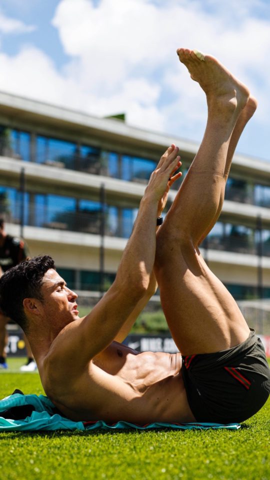 The 37-year-old does some stretches ahead of Portgual training