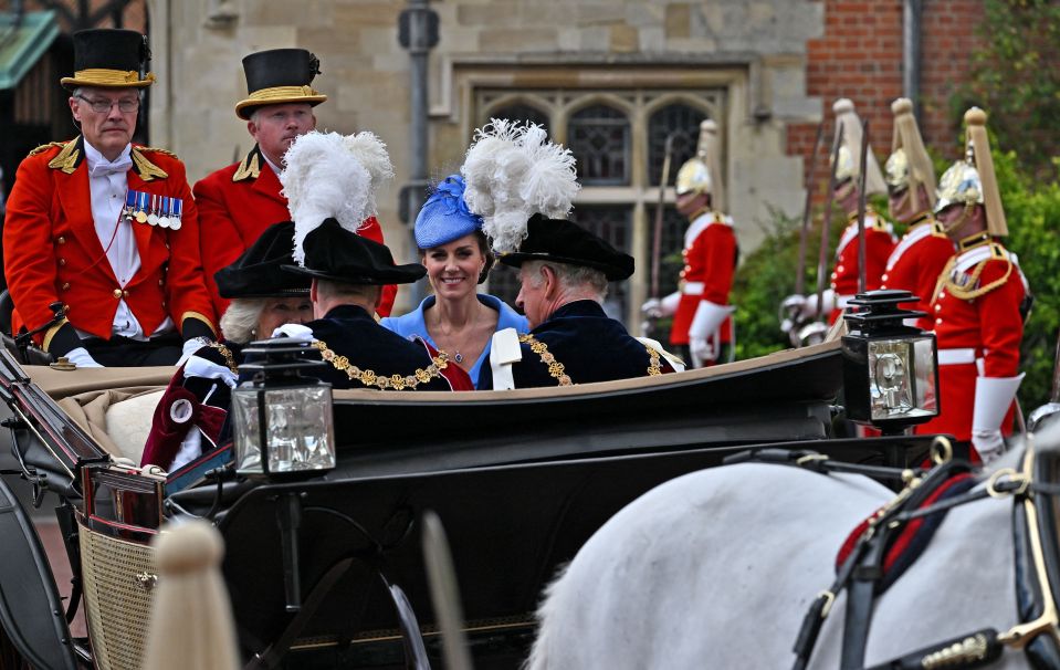 The Duchess of Cambridge can be seen smiling in the carriage