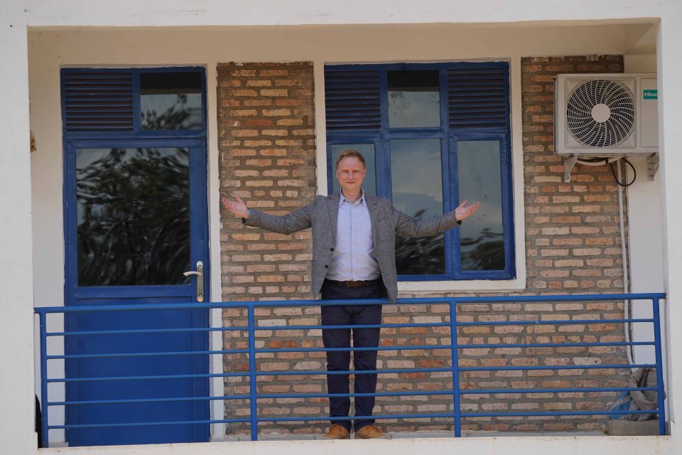 Chris Pollard stands outside the accommodation block