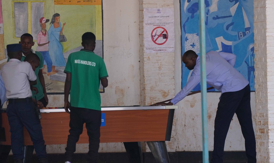 Young men playing snooker in the recreation room