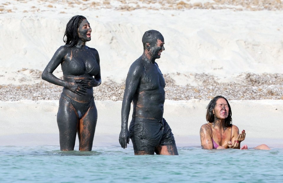 Nicole Scherzinger gets down and dirty with a Balearic mud bath alongside fashion designer pal Julien Macdonald