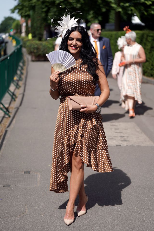 This woman opted for a brown polka dot dress for the celebrations