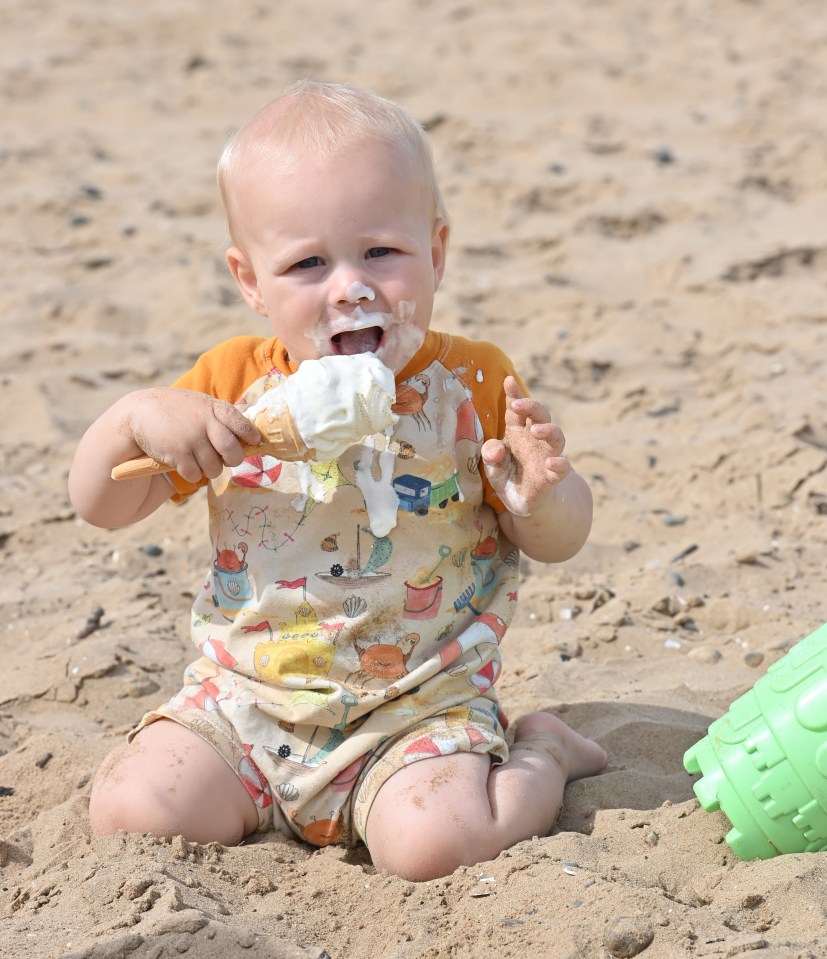 One-year-old Henry Smith enjoys an ice cream on St Anne's Beach Lancashire