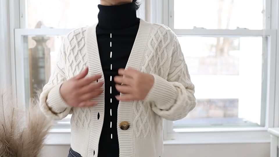 Layering a cardigan or blazer with a turtle neck will make it more flattering