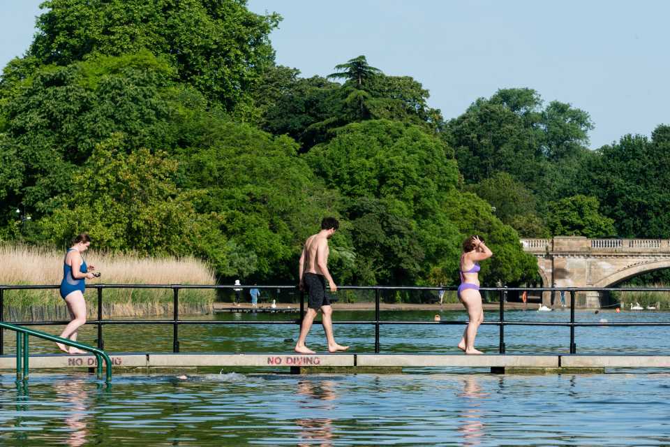 Others took an early morning swim during the hot weather at the Serpentine Lake in London