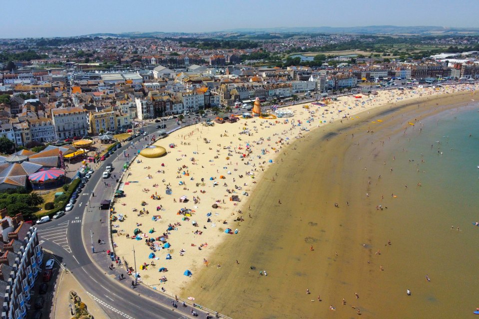 Weymouth Beach in Dorset is packed with sunbathers