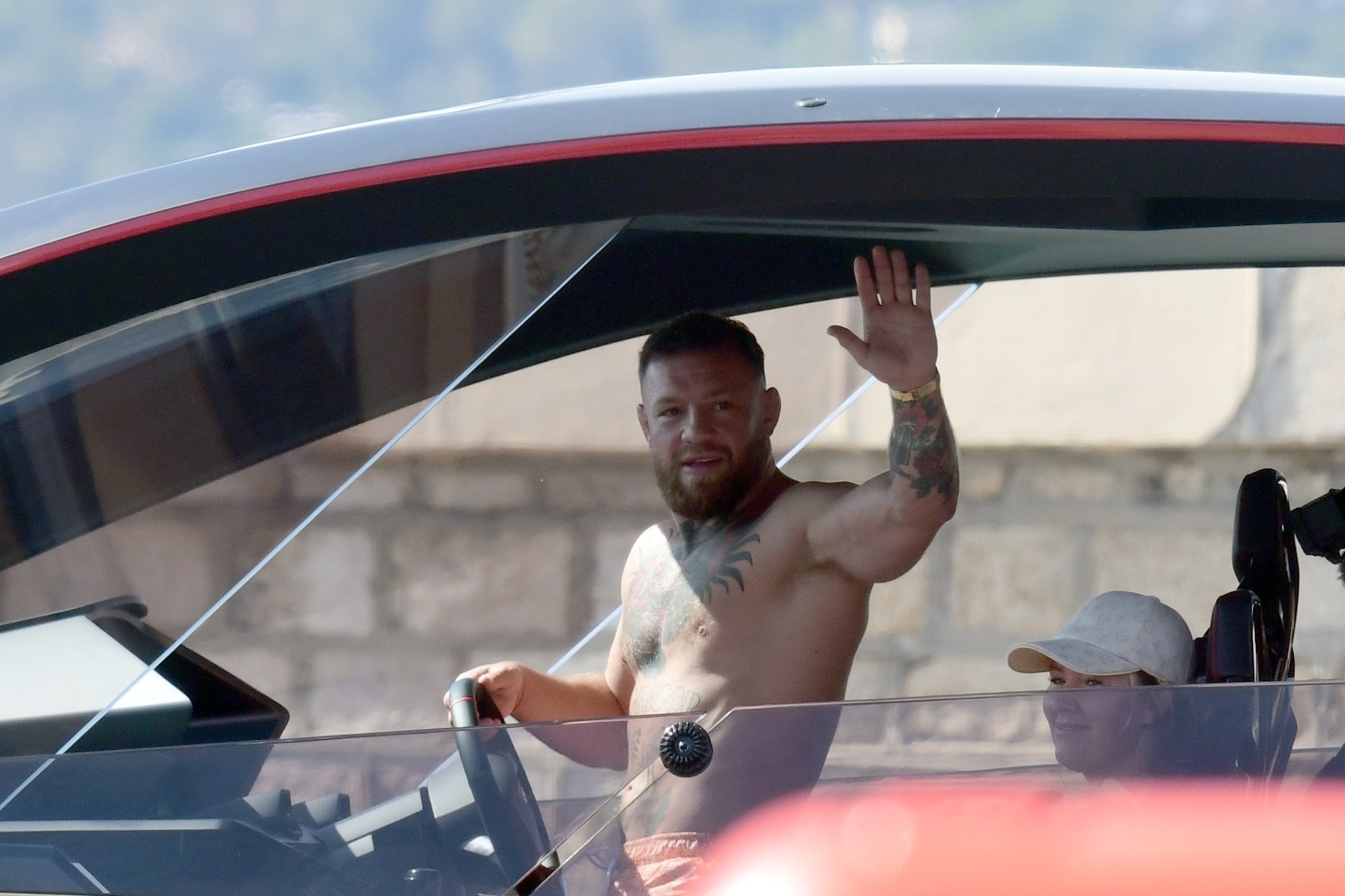 The Irishman was only too happy to wave to stunned onlookers from his yacht