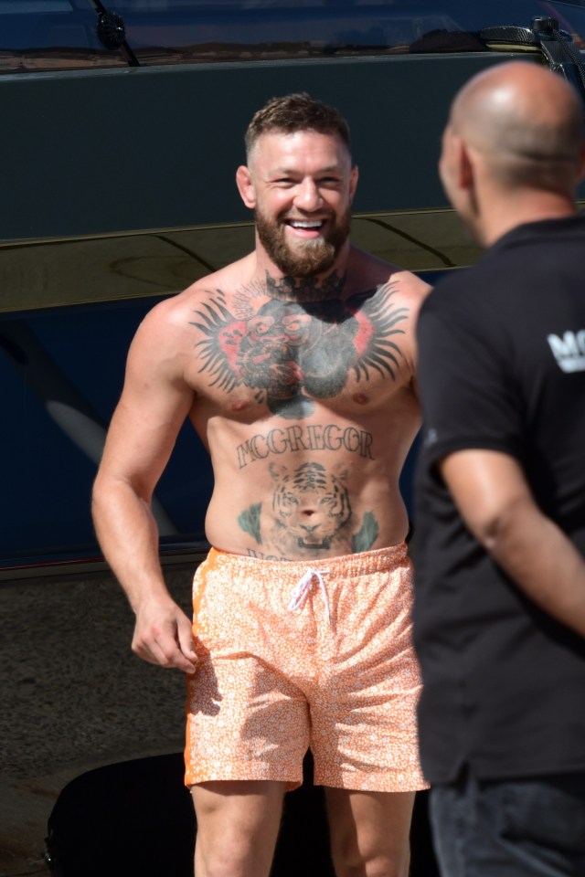 McGregor was decked out in orange swim shorts as he basked in the St Tropez sunshine