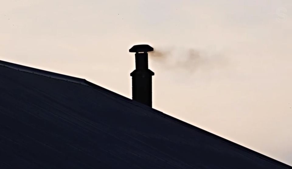 The neighbour's chimney constantly belches out noxious coal smoke