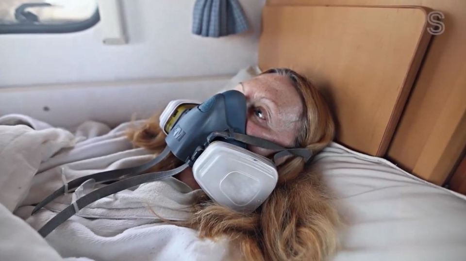 Svetlana Cohen is forced to sleep in a gas mask due to her neighbour's coal fire