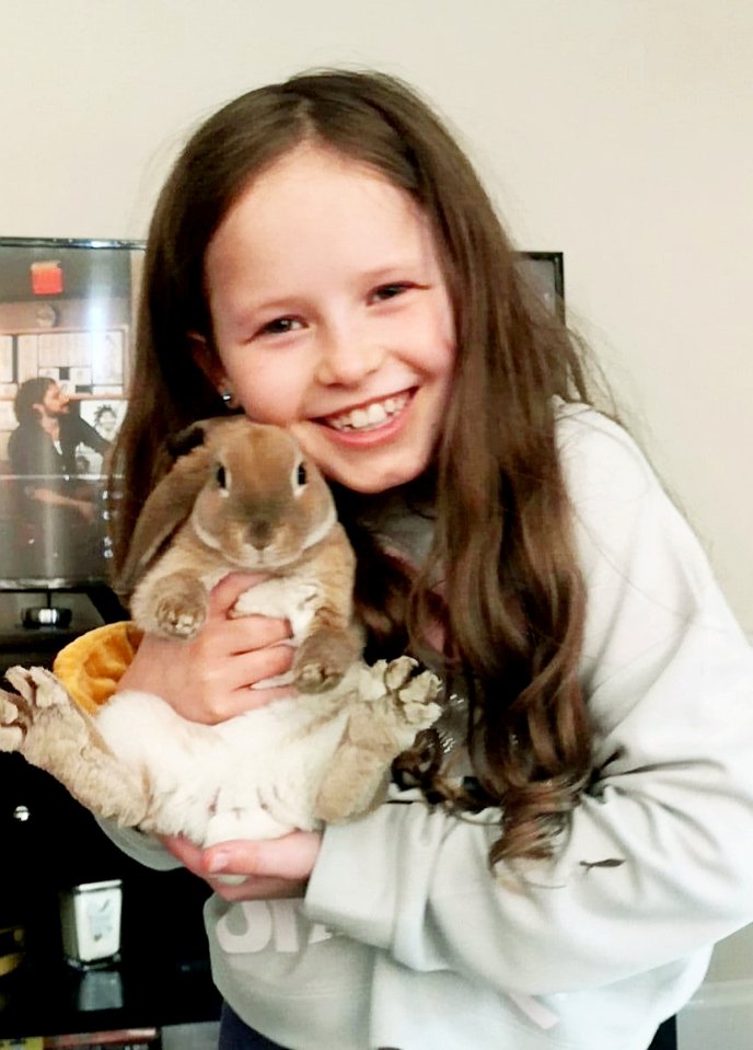 Erin’s daughter Maddison, 11, cuddling one of the bunnies