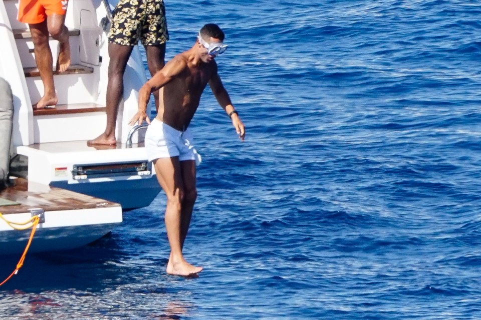 Ronaldo jumping feet-first into the cold water