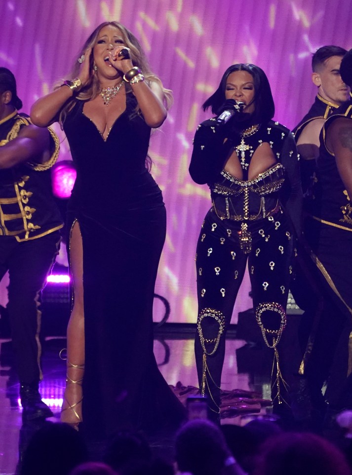 Mariah Carey wowed in a plunging black dress to perform a remix of Latto’s hit Big Energy