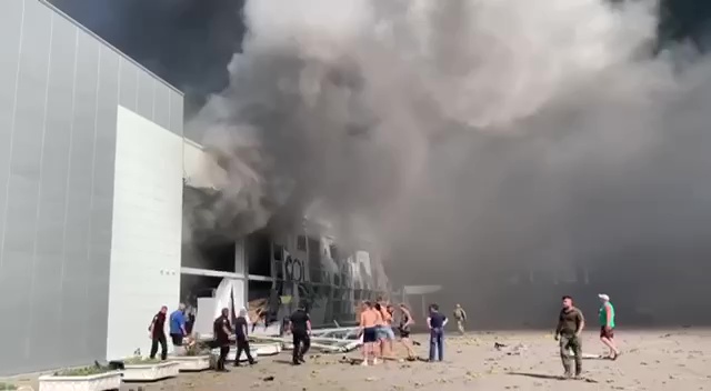 People escape the massive smoke cloud billowing from the mall