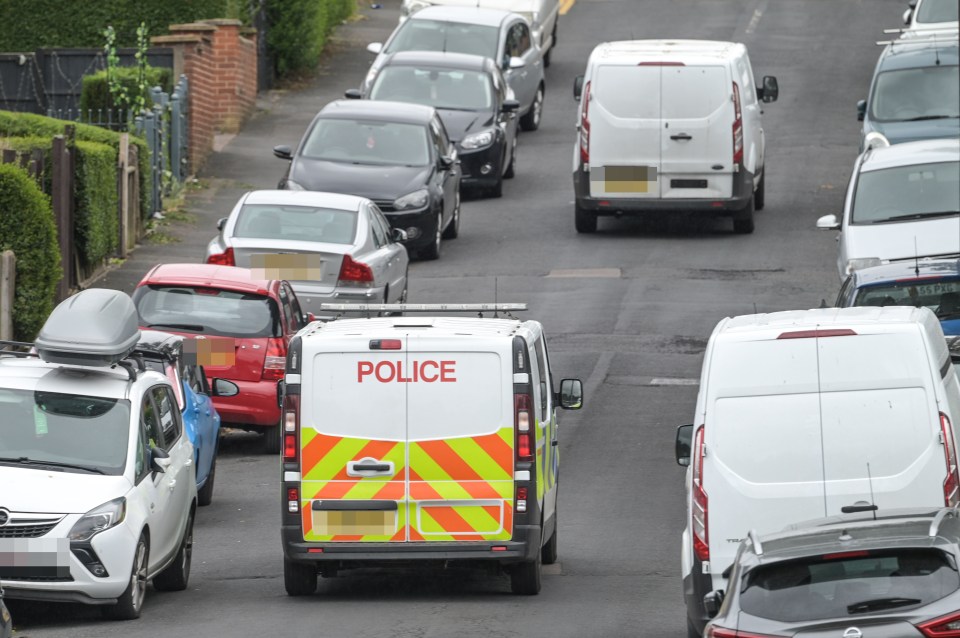 Cars block both sides of Alderton Road