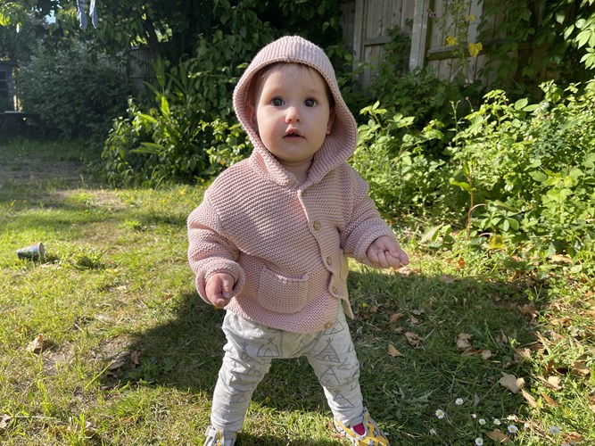 Baby Nikol in the garden of the family home