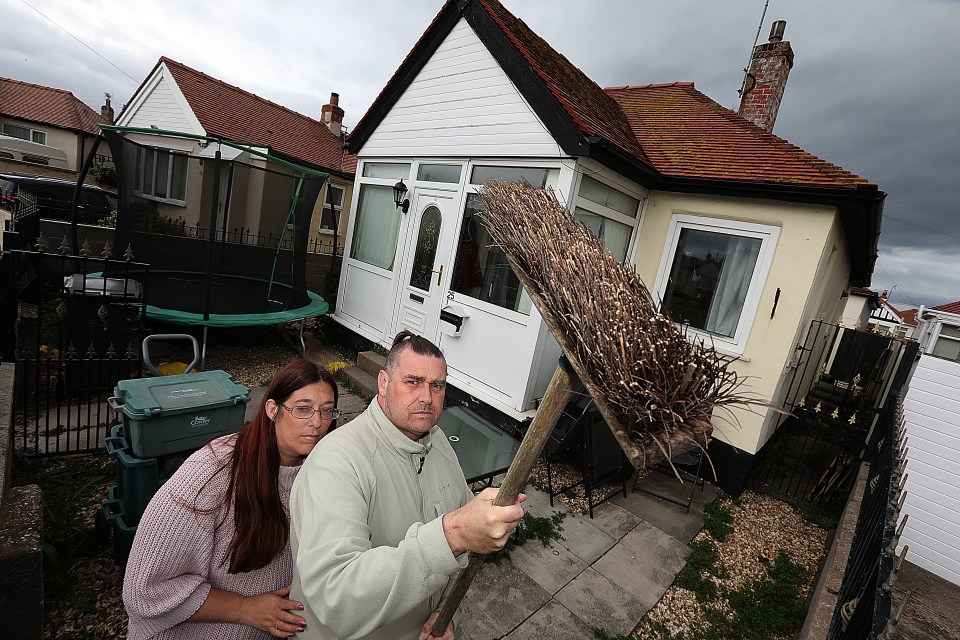 Nicki and Dave Baker say they have to be armed with a broom or garden parasol when they go outside