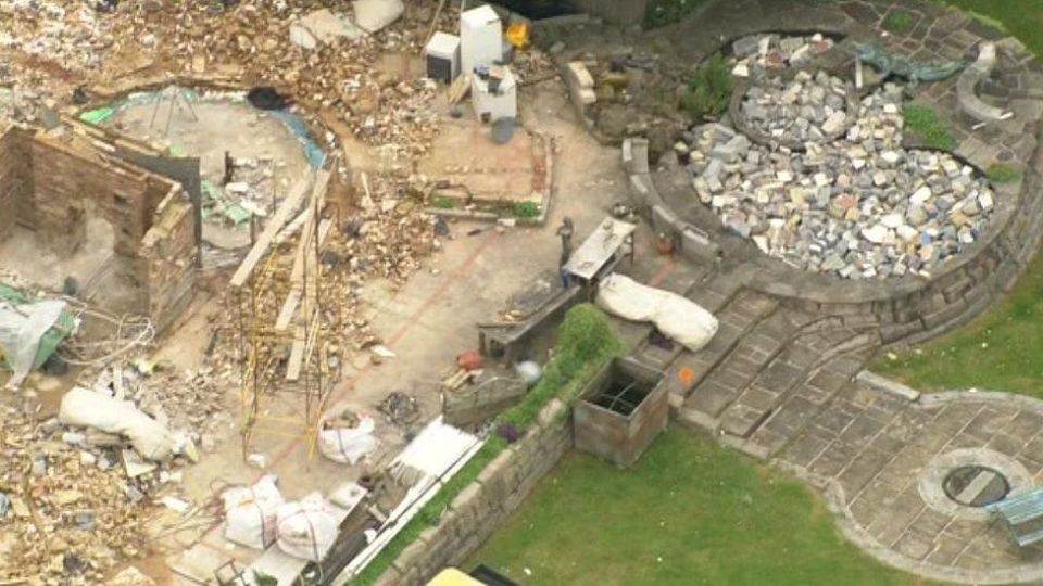 an aerial view of a house that is being demolished .