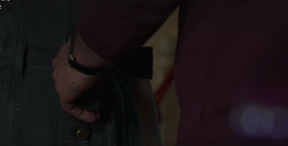 His hand was seen pulling at Janine's clothes