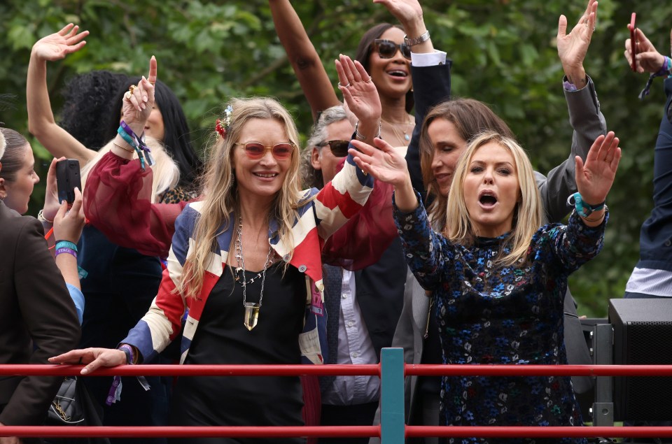 Kate, Charlotte Tilbury and Naomi Campbell ride a bus along the mall during the Platinum Pageant