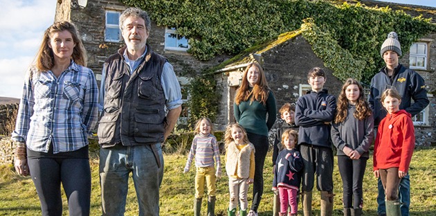 The couple have nine children - Anna, Clemmy, Raven, Sidney, Nancy, Miles, Edith, Violet and Reuben outside Ravenseat Farm