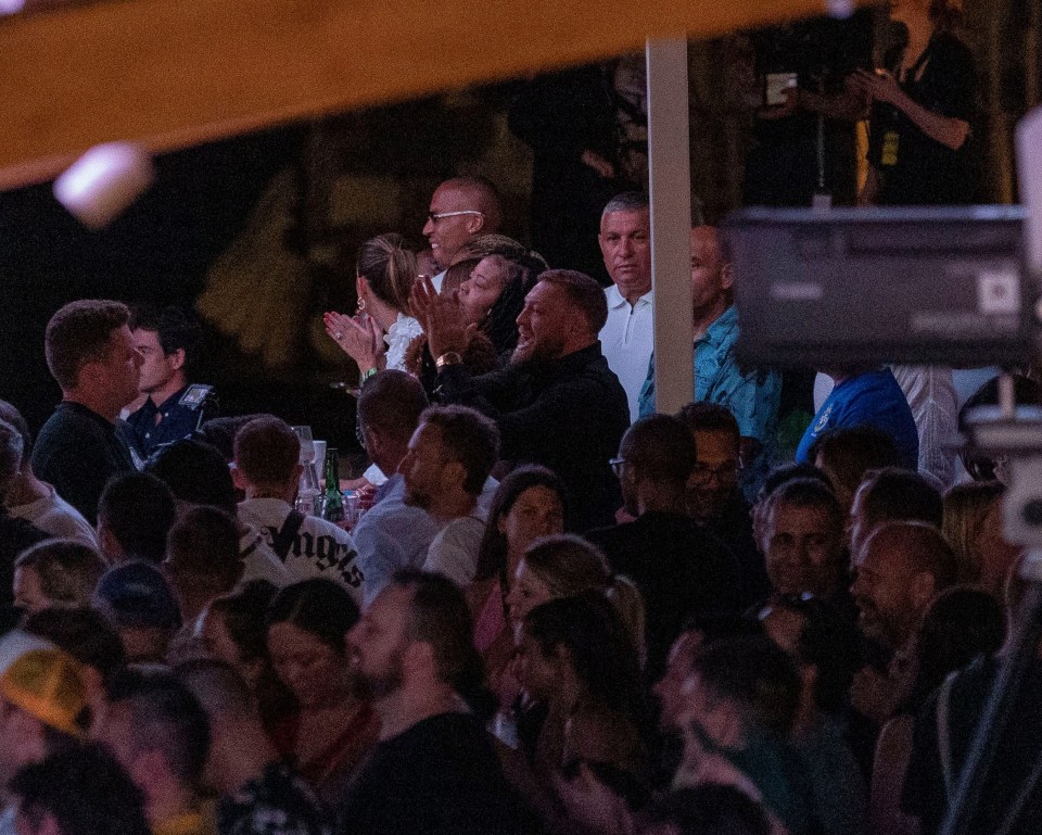 McGregor clapped along as he attended the concert