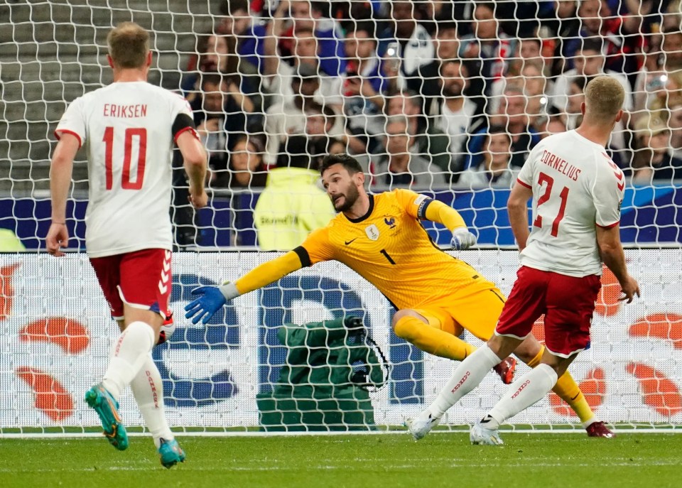 Andreas Cornelius volleys past Hugo Lloris in the France goal