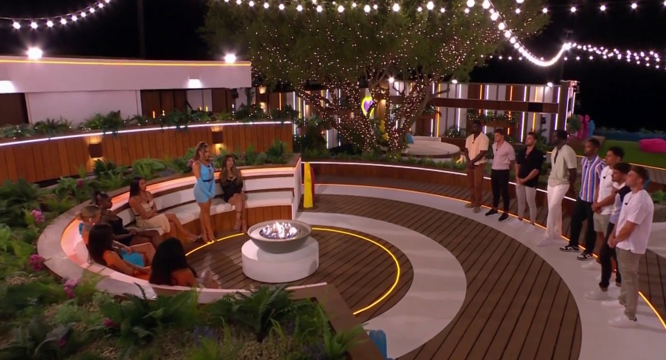 The Love Island girls gathered around the firepit to make their choices