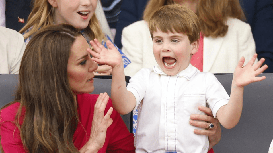 Kate supported her animated son as he watched the parade