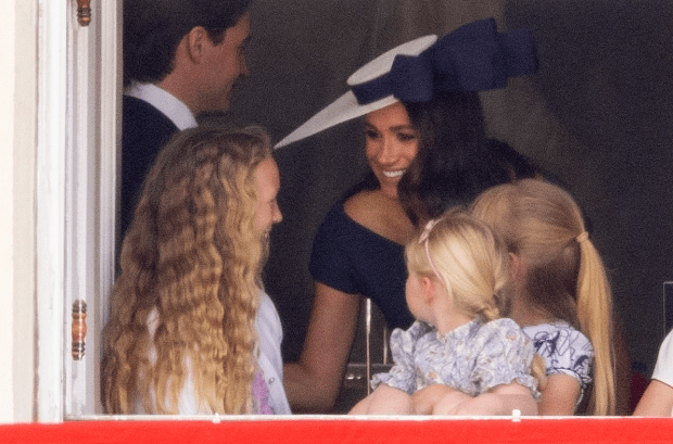 Meghan was still present despite also being blocked from the balcony