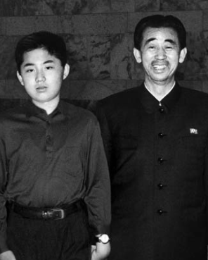 North Korean leader Kim Jong-un in his younger days as he poses for a photo with Army Marshal Hyon Chol-hae