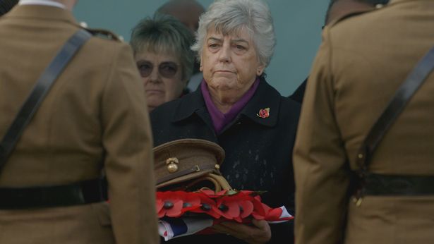 One family member Brenda attends the burial ceremony