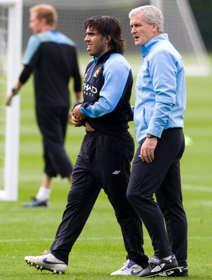 Mark Hughes with Carlos Tevez during his days managing Manchester City