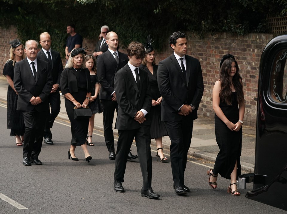 Dame Deborah James' children Hugo and Eloise led her funeral procession today