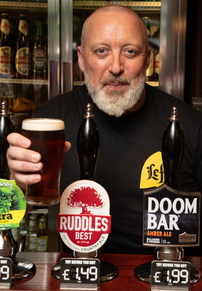 Barman Gerard Collins is pulling the bargain booze at The Walnut Tree, a Wetherspoons in Leytonstone, East London