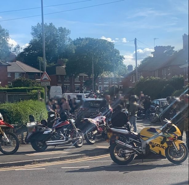 The group of bikers gathered in a nearby road before the 'blockade' took place