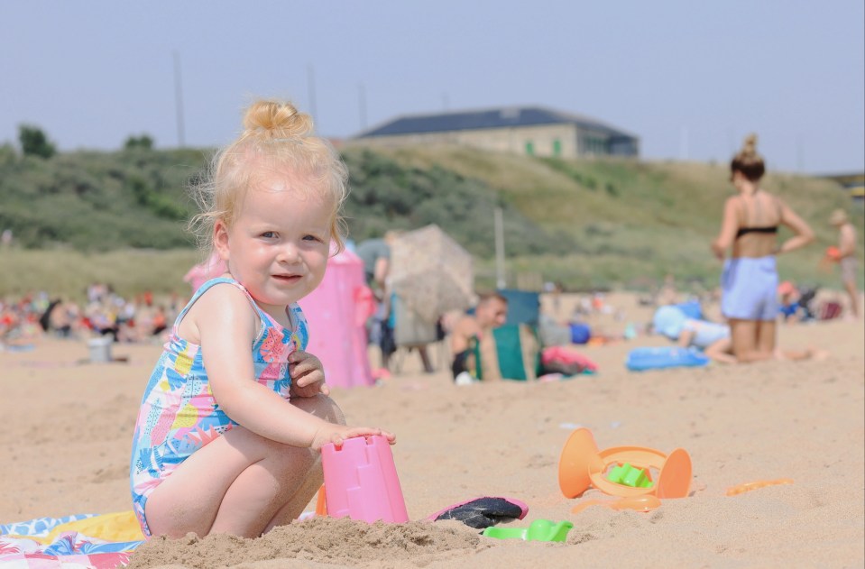 Fun on the beach for two-year-old Rosie Barrow