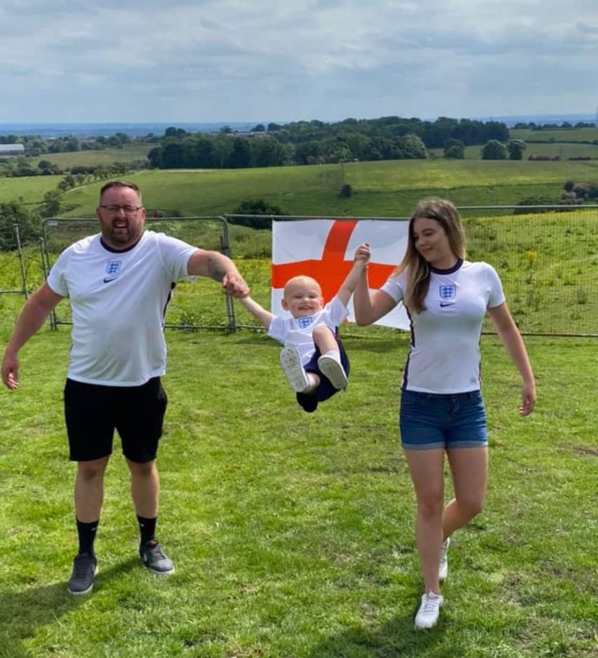 Albie supporting England in the World Cup with dad Neil and his partner Millie Barrick